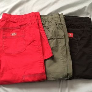 Lot of extra small scrubs, 3 pairs of pants 7 tops
